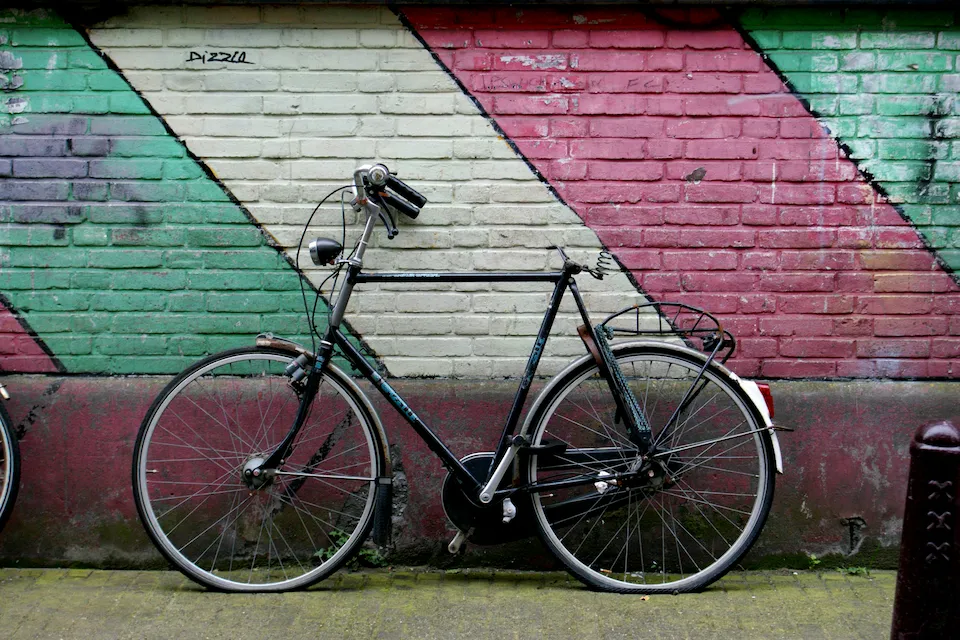 Bike leaning against a wall in Amsterdam