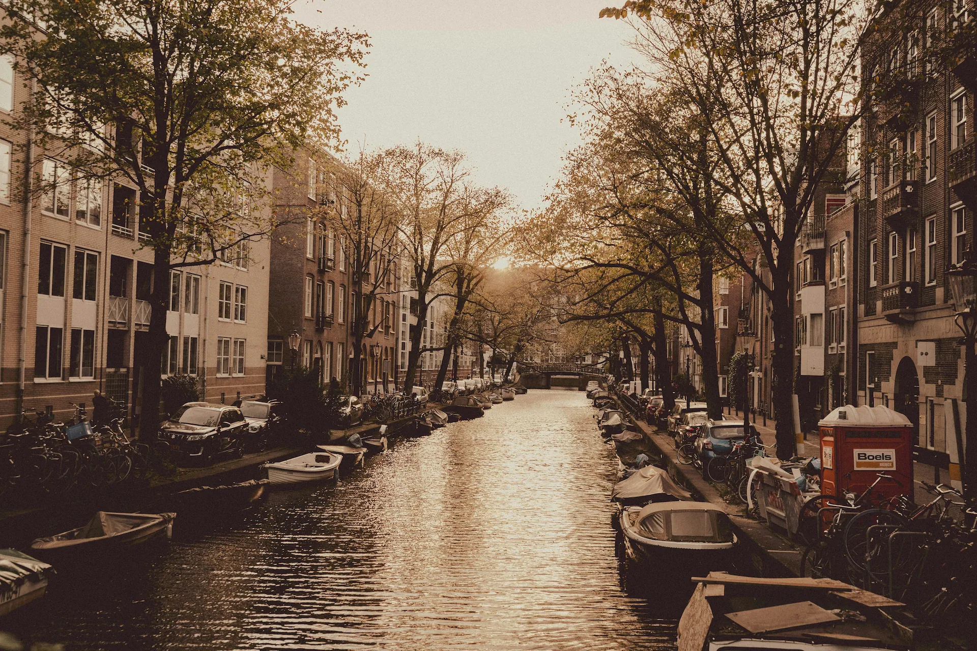 Amsterdam canal with boats and historic buildings